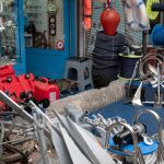 sea river site shop market with ship boat sail accessories like anchors, cables, ropes, buoy, beacons